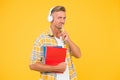 Audio library. Man handsome college student headphones books. Study languages. Another way of study. Learning english Royalty Free Stock Photo