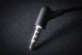 Audio Mini Jack plug on black background