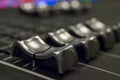 Audio Mixer with Faders pushed up on a Yamaha Mixer