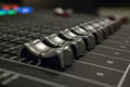 Audio Mixer with Faders pushed up on a Yamaha Mixer