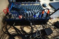 Audio mixer in a recording studio. Panel with wires and plugs Royalty Free Stock Photo