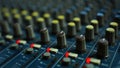 Audio sound mixer with mute button and fader knobs Royalty Free Stock Photo
