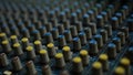 Audio sound mixer with blue and yellow fader knobs Royalty Free Stock Photo