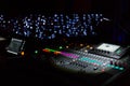 Audio sound mixer console with buttons and sliders with lights at the concert. Selective focus Royalty Free Stock Photo