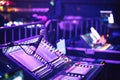 Audio sound mixer console with buttons, sliders and microphone at the concert. Selective focus Royalty Free Stock Photo