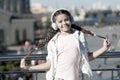 Audio tour headphones gadget. City guide and audio tour. Girl little tourist kid explore city using audio guide