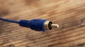 audio-video analog cable  on an old wood table background Royalty Free Stock Photo