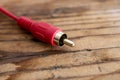 audio-video  analog cable on an old wood table background Royalty Free Stock Photo