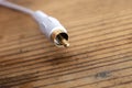 White audio-video analog cable on an old wood table background Royalty Free Stock Photo