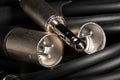 audio xlr trs cable plugs macro on black Royalty Free Stock Photo