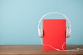 Audiobook concept with book and headphones