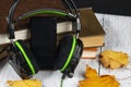 Audiobook concept.Headphones and a smartphone and old books Royalty Free Stock Photo