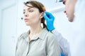 Audiologist Examining Woman