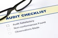Audit checklist with glasses