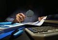 Auditor checks financial report with magnifying glass. Internal audit and business analysis Royalty Free Stock Photo