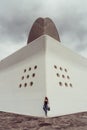 Auditorio de Tenerife, Santa Cruz de Tenerife, Espania - October 26, 2018: A woman photographed leaning against the wall of the