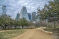 Auditorium Shores Park, Austin, Texas- Pathway with a citscape view against the clouds