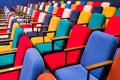 The auditorium in the theater. Multicolored spectator chairs