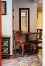 Oriental vintage living room with wooden furniture in old house with mosaic floor