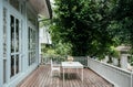 Oriental vintage home with outdoor wooden furniture in old house balcony
