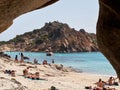 2021 AUG - ITA - view of tourists in the beach of the little island of SPARGI in the archipelago La Maddalena in Sardinia - Royalty Free Stock Photo