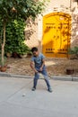 Aug 2017, Kashgar, Xinjiang, China: local uighur child playing spinning top in the streets of Kashgar Old Town