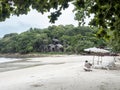 4 aug 20, Koh Samed, Thailand. housekeeper working near beach bed at sea view resort.