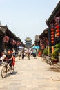 Aug 2013 - Pingyao, Shanxi, China - Tourists and locals in the South Street of Pingyao, one of the main roads of the old city.