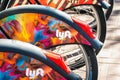 Aug 21, 2019 San Francisco / CA / USA - Close up of Lyft logo on a Bay Wheels bicycle wheel parked at a station; Motivate the Royalty Free Stock Photo