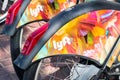 Aug 21, 2019 San Francisco / CA / USA - Close up of Lyft logo on a Bay Wheels bicycle wheel parked at a station; Motivate the Royalty Free Stock Photo