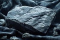 Augite stone resting on black velvet in a dramatic low key setting highlighting its textures Royalty Free Stock Photo