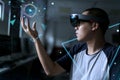 Augmented Reality boy with hololens glasses in the lab room. Advanced technology with mixed reality concept