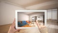 Augmented reality concept. Hand holding tablet with AR application used to simulate furniture and design products in empty