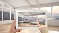 Augmented reality concept. Hand holding tablet with AR application used to simulate furniture and design products in empty