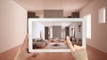 Augmented reality concept. Hand holding tablet with AR application used to simulate furniture and design products in empty