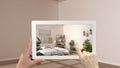 Augmented reality concept. Hand holding tablet with AR application used to simulate furniture and design products in empty