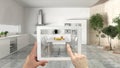 Augmented reality concept. Hand holding tablet with AR application used to simulate furniture and interior design products in real