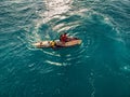 August 8, 2021. Bali, Indonesia. Aerial view with couple surfers on jet ski looking for big wave. Tow in surfing in Bali