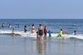 Beach goers enjoying the sun, sand and surf at Rockaway Beach