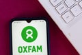 August 26, 2020, Brazil. In this photo illustration the Oxfam International logo seen displayed on a smartphone Royalty Free Stock Photo