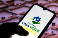 August 5, 2021, Brazil. In this photo illustration the Programa Casa Verde e Amarela logo seen displayed on a smartphone