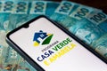 August 5, 2021, Brazil. In this photo illustration the Programa Casa Verde e Amarela logo seen displayed on a smartphone