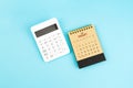 August 2026 brown caculator and white calculator on blue color background Royalty Free Stock Photo
