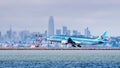 August 19, 2019 Burlingame / CA / USA - Korean Air aircraft landing at San Francisco International Airport; The financial district