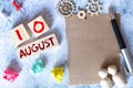 August 10 - Daily colorful Calendar with Block Notes and Pencil on wood table background.