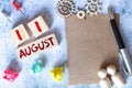 August 11 - Daily colorful Calendar with Block Notes and Pencil on wood table background