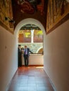 August 2018 - Cyprus: Greek orthodox priest talking to a man in the Greek orthodox Kykkos monsatery of the Holy Virgin in Troodos