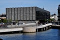 Denmark`s central bank grey building on canal in Copenhagen