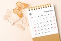 A August 2023 desk calendar for the organizer to plan and reminder and butterfly paer on yellow background