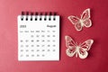 A August 2023 desk calendar for the organizer to plan and reminder with paer butterfly on red background Royalty Free Stock Photo